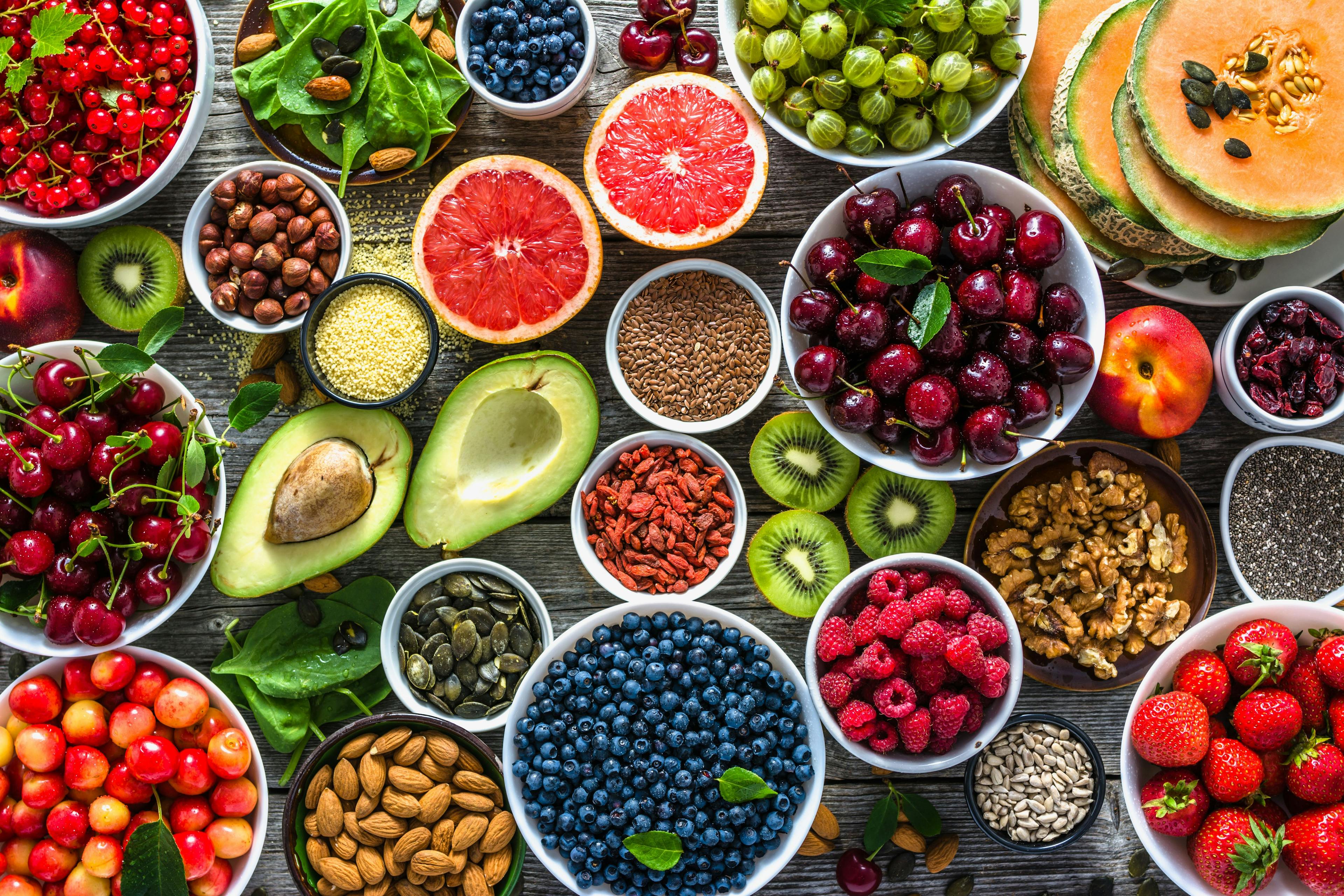 Selection of healthy food. Superfoods, various fruits and assorted berries, nuts and seeds. | Image Credit: © alicja neumiler - stock.adobe.com