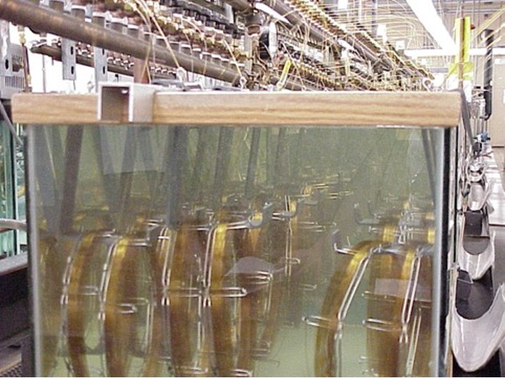 Figure 5: GC columns being coated in a water batch to carefully control the column temperature.