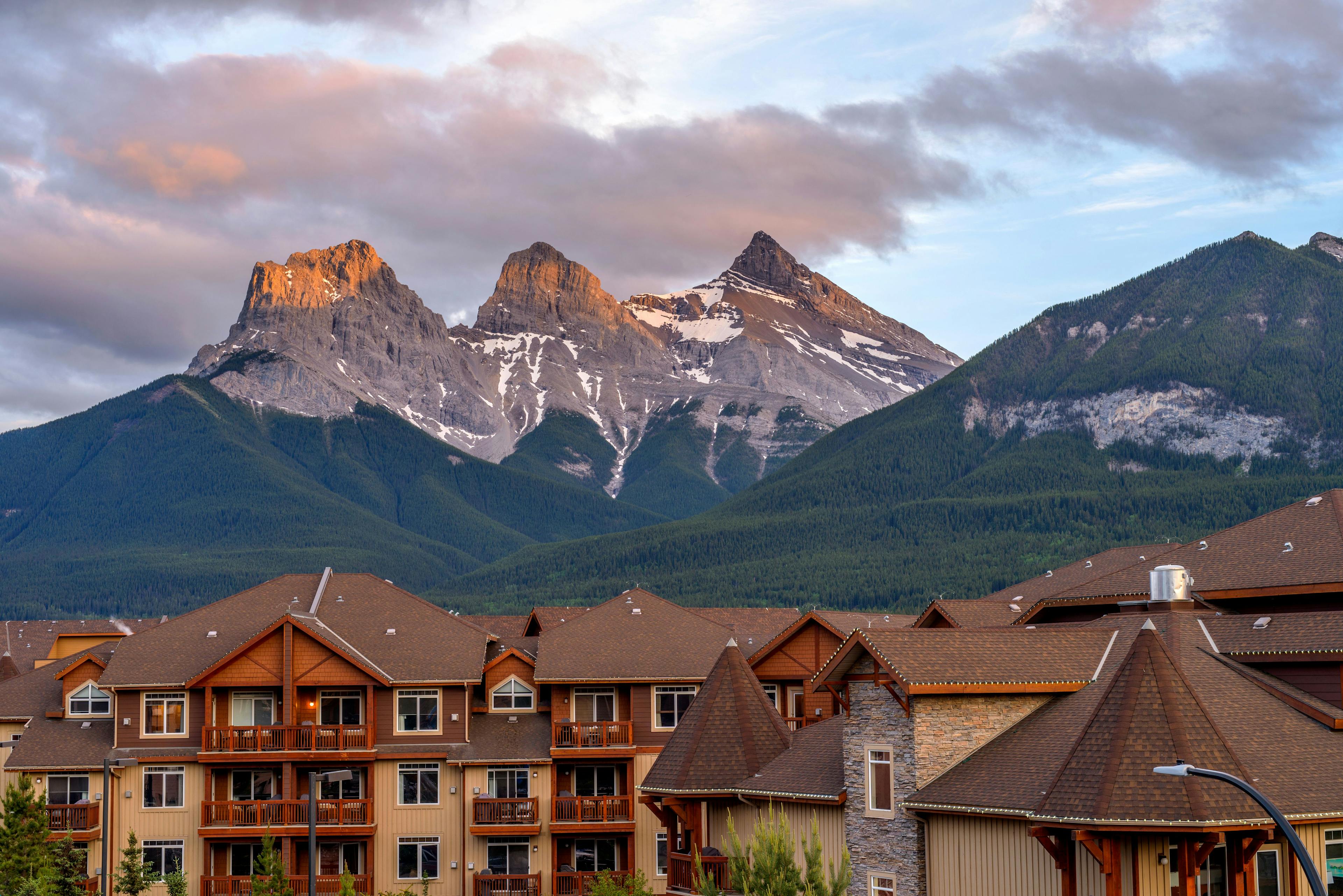 The Three Sisters - A Spring sunset view of The Three Sisters mountain, seen from town of Canmore, Alberta, Canada | Image Credit: © Sean Xu - stock.adobe.com