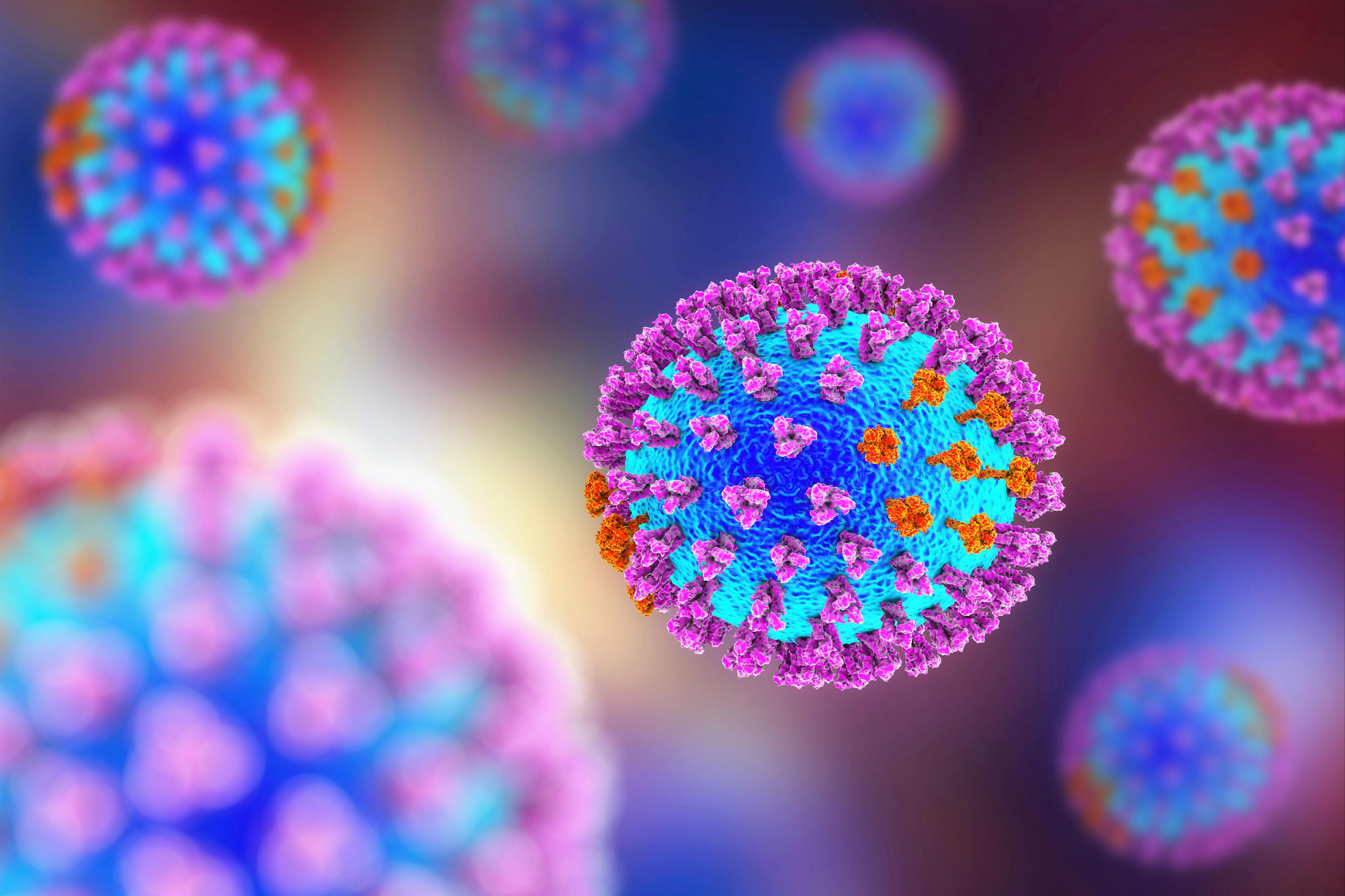 Influenza virus. 3D illustration showing surface glycoprotein spikes hemagglutinin purple and neuraminidase orange | Image Credit: © Dr_Microbe - stock.adobe.com