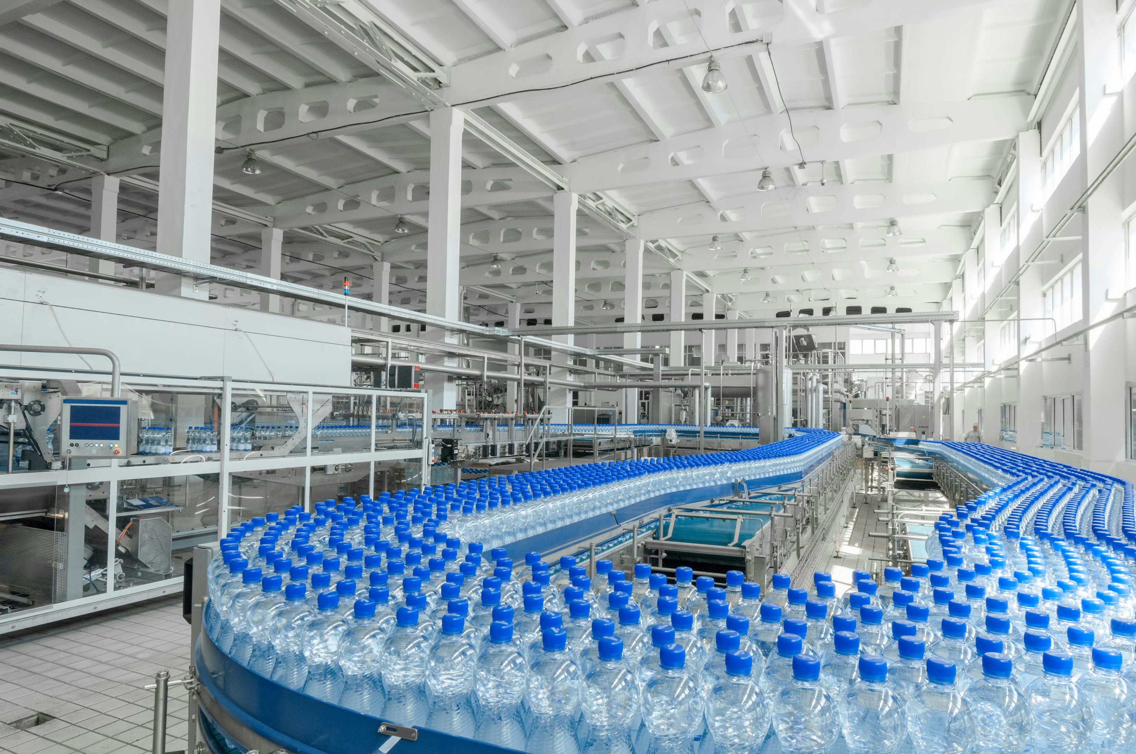 for the production of plastic bottles and bottles on a conveyor belt factory | Image Credit: © warloka79 - stock.adobe.com