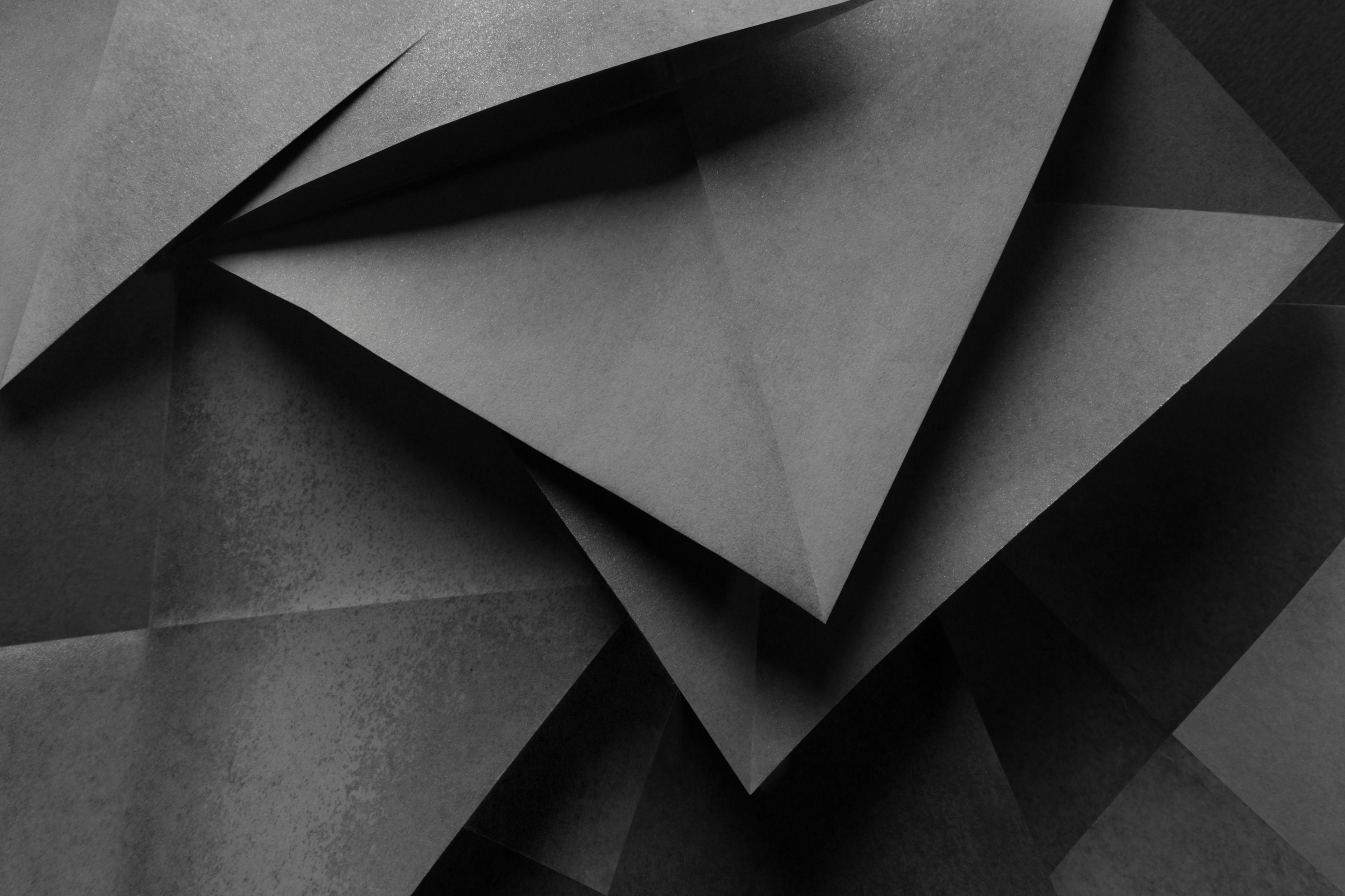 Geometric shapes made gray paper, abstract background | Image Credit: © Allusioni - stock.adobe.com.