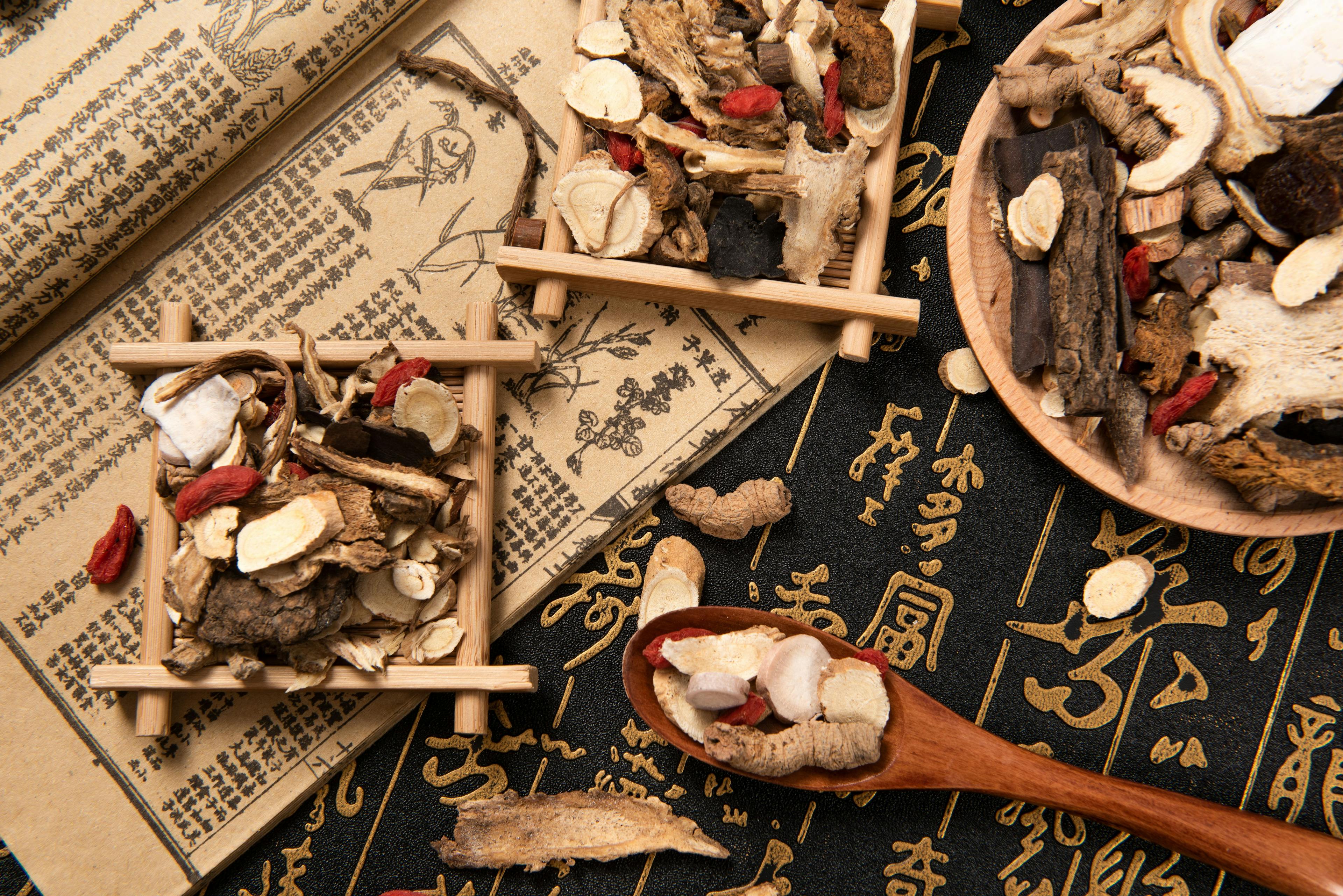 Chinese herbal medicine selection on calligraphy background | Image Credit: © zhikun sun - stock.adobe.com