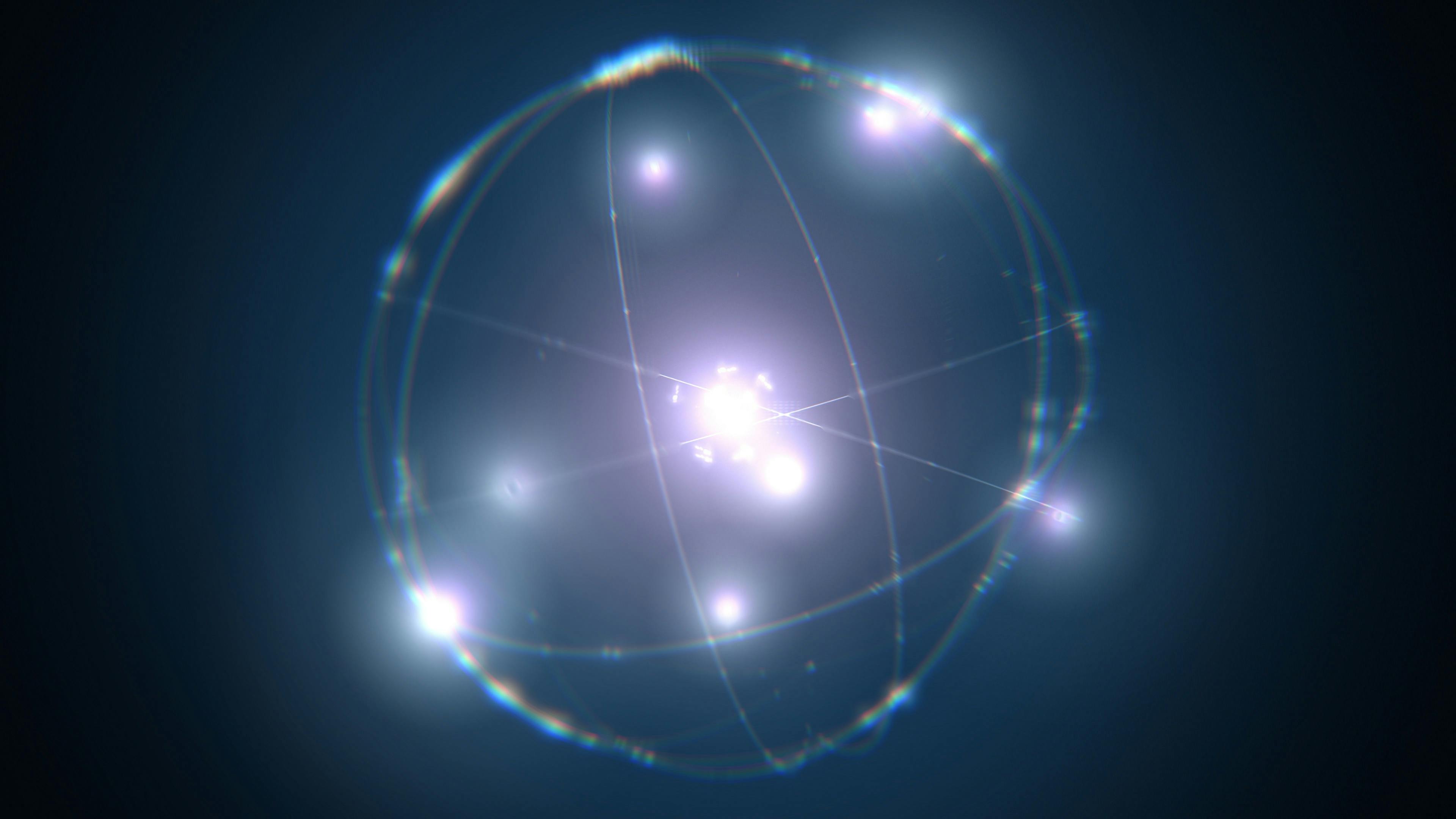 Dynamic energetic blue atom model concept illustration of glowing proton neutron nucleus, visualization of atom space physics of centric gravity as idea of electrons orbiting as ordered particles | Image Credit: © remotevfx - stock.adobe.com