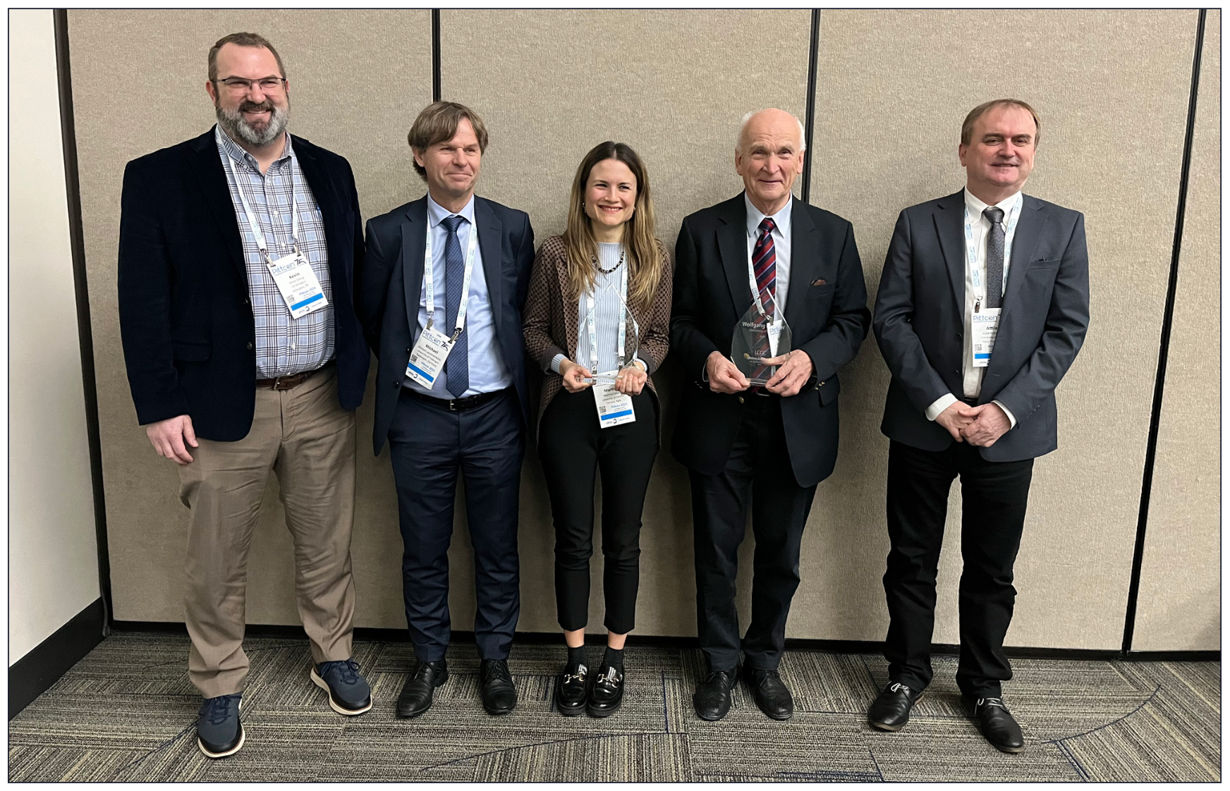IMAGE 2: Wolfgang Lindner and Martina Catani pose for a photo with speakers from their award’s symposium at Pittcon 2024.