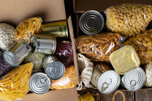 Food donations on the table. Text Donation. Close up. | Image Credit: © fotofabrika - stock.adobe.com