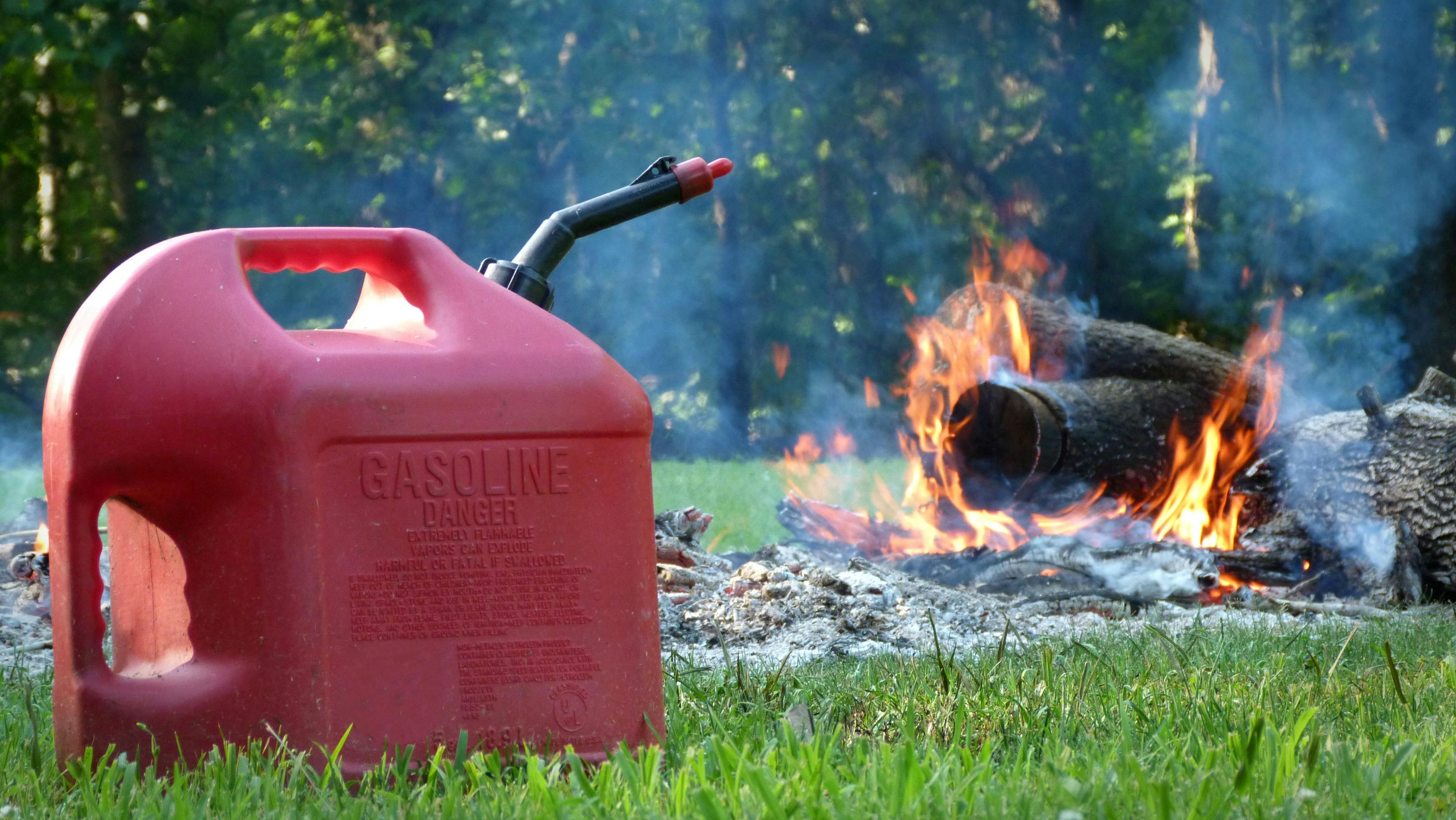 Gasoline Can in front of a Fire, Fire Hazard, Burning Hazard | Image Credit: © Alissa Yarbrough - stock.adobe.com