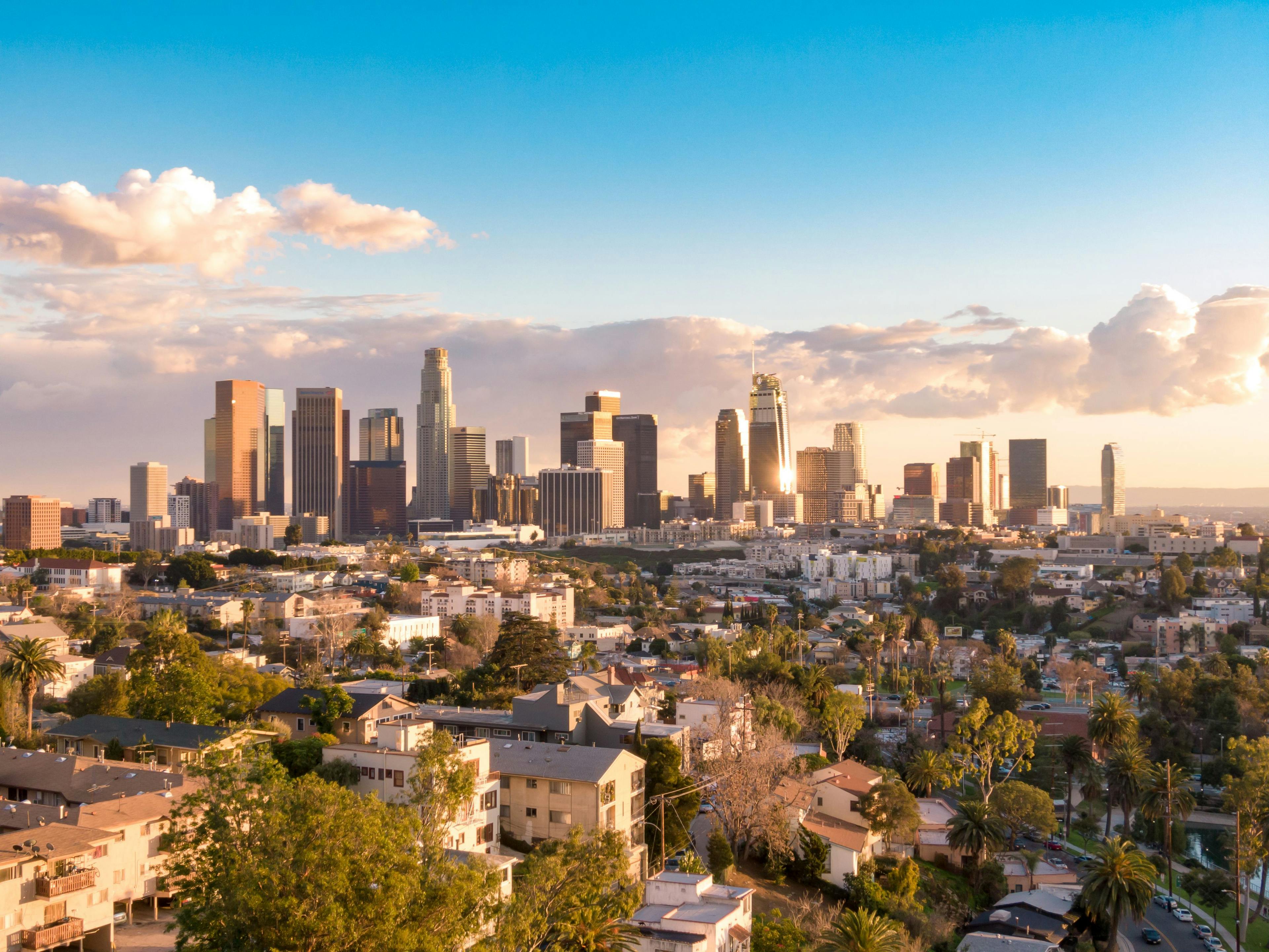 Aerial view of downtown Los Angeles city skyline and skyscrapers on a sunny day. | Image Credit: © Newport Coast Media - stock.adobe.com.