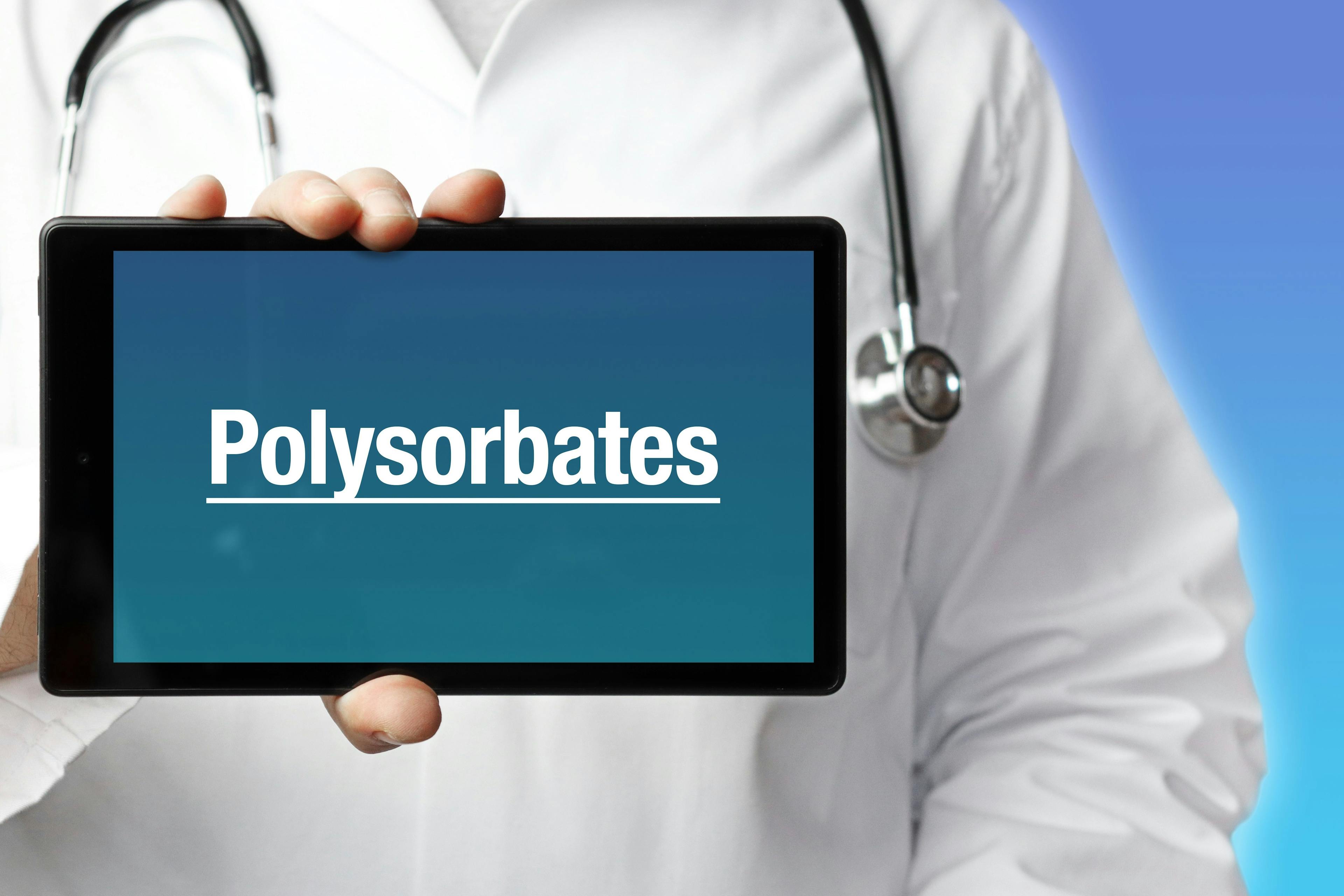 Polysorbates. Doctor in smock holds up a tablet computer. The term Polysorbates is in the display. Concept of disease, health, medicine | Image Credit: © MQ-Illustrations - stock.adobe.com