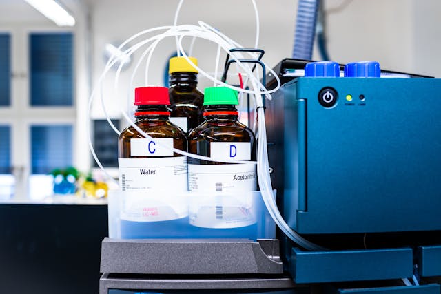 Stock solutions for a purpose of liquid chromatography analysis, bottles are connected directly to the LC machine, science and research background | Image Credit: © Forance - stock.adobe.com